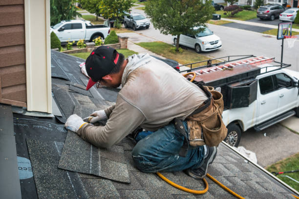 Professional Roofing technician working in Kirkman, IA
